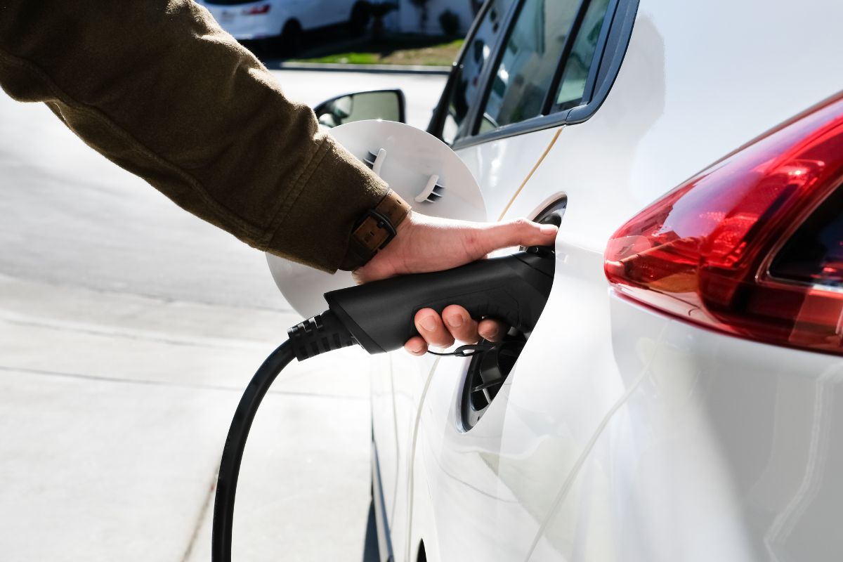 Hand is charging an electric car